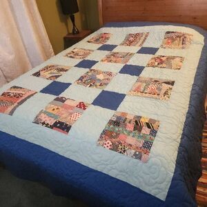 Queen size quilt.  Bright vibrant colors.  Vintage-style looking fabrics. NWOT